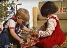 Children opening their gifts